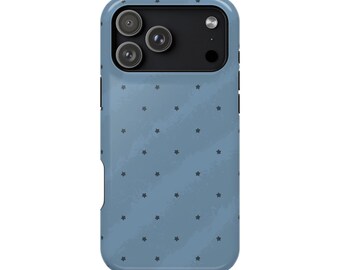 May include: A dusty blue smartphone case featuring a repeating pattern of small dark gray stars. The case has a rectangular black camera module cutout at the top, designed to accommodate a triple-lens camera system and a flash.