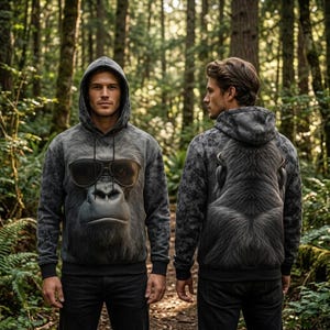 May include: A grey hooded sweatshirt featuring a large, realistic graphic of a gorilla wearing black sunglasses on the front and the back of the gorilla's head and shoulders printed on the back, with long sleeves and a drawstring hood.