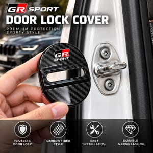 May include: A circular car door lock cover featuring a black carbon fibre pattern and the GR SPORT logo in red, white, and black. The cover has a horizontal cutout and is held next to a metal car door latch mechanism with two visible screws.