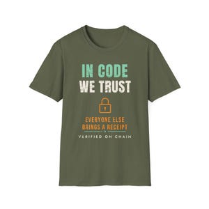 May include: An olive green short-sleeve t-shirt featuring the text IN CODE WE TRUST in light blue and white, an orange padlock icon, the text EVERYONE ELSE BRINGS A RECEIPT in orange, and the text VERIFIED ON CHAIN in white at the bottom.