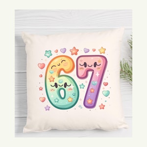 May include: A cream-colored square pillow featuring the number 67 in a colorful, cartoonish style. The numbers are decorated with stars, hearts, and smiling faces. The pillow is a decorative item.