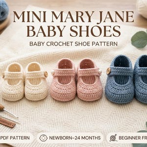 May include: Three pairs of crochet baby shoes in cream, dusty pink, and blue, each featuring a single strap with a wooden button. The text reads MINI MARY JANE BABY SHOES, BABY CROCHET SHOE PATTERN, PDF PATTERN, NEWBORN-24 MONTHS, BEGINNER FRIENDLY.