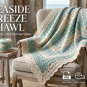 May include: A crochet shawl featuring a repeating lace pattern in cream, sage green, and light blue. The text SEASIDE BREEZE SHAWL ORIGINAL CROCHET PATTERN is visible. A yarn ball and hook are nearby. The dimensions are listed as 60 x 24 inches.