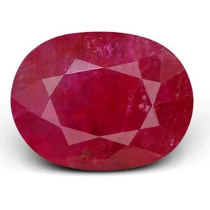 May include: A vibrant, oval-cut ruby gemstone featuring a deep, saturated red color. The stone displays a faceted surface with a clear, symmetrical pattern of triangular and diamond-shaped reflections that catch the light across its polished face.