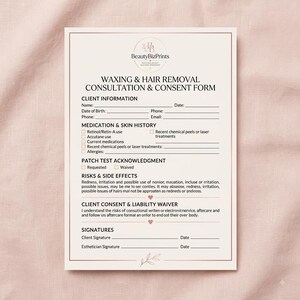 May include: A printed waxing and hair removal consultation and consent form on cream paper with dark text. The document includes sections for client information, medication and skin history, patch test acknowledgment, risks, and signatures.