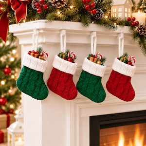 May include: Four knitted Christmas stockings hanging in an alternating red and green pattern. Each stocking features a white ribbed cuff and a white hanging loop. The stockings are filled with small wrapped gift boxes and candy canes.