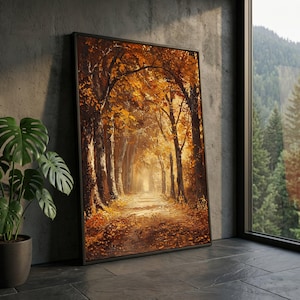 Può includere: Una stampa artistica da parete rettangolare incorniciata che raffigura un sentiero nel bosco durante l'autunno. La scena presenta alberi alti con un fitto fogliame arancione e dorato che costeggia un sentiero sterrato coperto di foglie cadute.