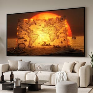 May include: A large rectangular wall art print featuring an antique-style world map illuminated by a glowing orange sun setting over a calm ocean. The map displays continents, nautical illustrations, and the text Mare Atlanticum in black ink.