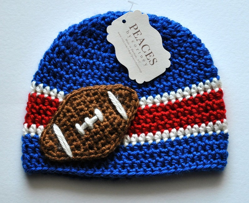 Royal blue, white, and red stripe baby hat with football applique.