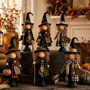 May include: Six decorative witch figurines standing on black circular bases. Each figure wears a tall black pointed hat with a star or moon accent, a plaid scarf, and holds a small accessory like a broom, pumpkin, bell, or wooden tag.