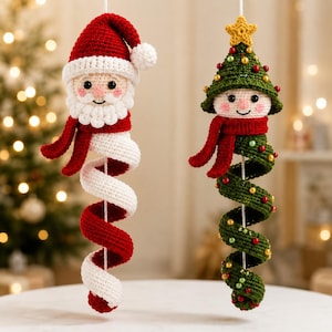 May include: Two hanging crochet ornaments featuring a Santa Claus figure and a Christmas tree figure. The Santa has a red hat, white beard, and a red and white spiral body. The tree has a yellow star, green foliage, and a red scarf with a green spiral body.