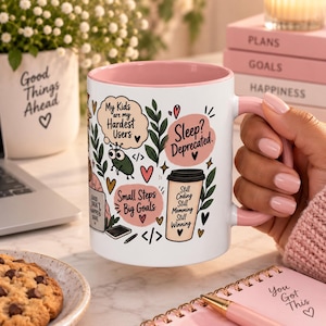 May include: A white ceramic mug with a pink interior and handle, featuring colorful illustrations of a coffee cup, a small bug, and text bubbles that read My Kids are my Hardest Users, Sleep? Deprecated, and Still Coding Still Momming Still Winning.
