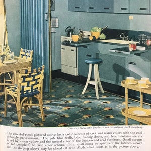 May include: A kitchen with blue walls, blue folding doors, and blue linoleum flooring. The kitchen features a small table with two chairs, a small cabinet with a countertop, and a small cart with a glass top. The kitchen has a color scheme of cool and warm colors with the cool definitely predominant. The pale blue walls, blue folding doors, and blue linoleum are relieved by lemon yellow and the natural color of the bamboo and reed furniture. Small accents of red complete the triad color scheme.