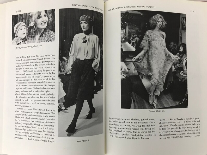 May include: A black and white photograph of a fashion designer, Jean Muir, wearing a white blouse and black trousers. The photo is from a fashion magazine and includes the text "Jean Muir 76".