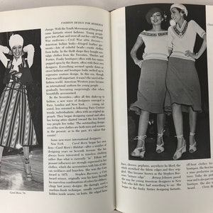 May include: Two women wearing white and red striped sweaters with matching skirts. The women are standing on a stage and smiling at the camera. The image is from a book about fashion design.
