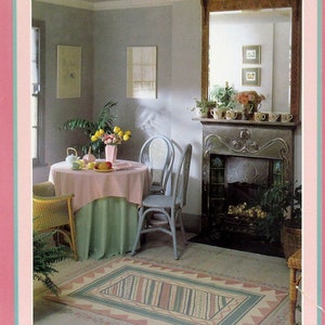 May include: A book titled "Setting Up Home" by Mary Gilliatt, featuring a photograph of a living room with a fireplace, a table with chairs, and a rug with a colourful geometric pattern.
