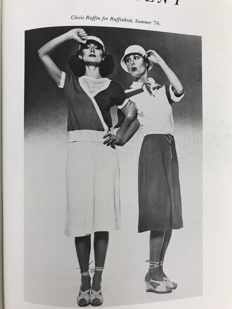 May include: Two women wearing white and black summer outfits with white shoes and hats. The text "Clovis Ruffin for Ruffinknit, Summer '76." is printed below the image.