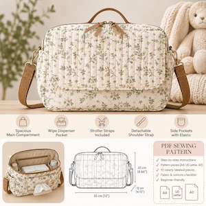 May include: A quilted diaper bag with a cream and green floral pattern, featuring a top handle, detachable shoulder strap, and side pockets. The bag measures 33 cm by 22 cm by 12 cm, or 13 inches by 8.66 inches by 4.72 inches, and includes a wipe dispenser pocket.