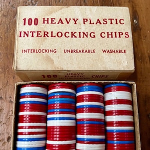 May include: A box of 100 heavy plastic interlocking chips. The chips are red, white, and blue. The box says "100 Heavy Plastic Interlocking Chips" and "Interlocking Unbreakable Washable".