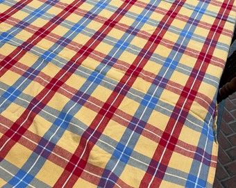 Vintage plaid farmhouse tablecloth in golden yellow, red and blue