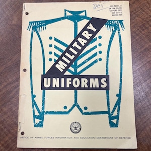 May include: Vintage booklet titled "MILITARY UNIFORMS" with a teal and black graphic of a military uniform on the cover. The booklet has a cream-colored background and includes text from the Office of Armed Forces Information and Education, Department of Defense.