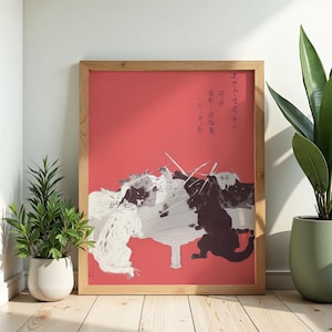 Peut inclure: Une impression d'art encadrée sur fond rouge représentant un groupe de chats noirs et blancs interagissant autour d'une table. Les chats sont dessinés de manière stylisée, certains tenant de fines baguettes. Calligraphie japonaise en haut à droite.