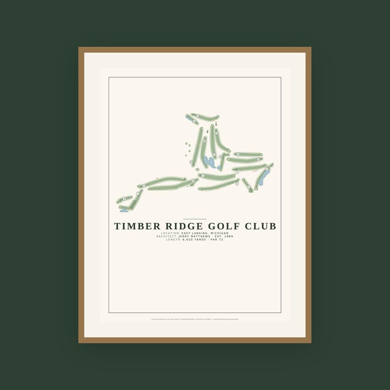 May include: A framed print featuring a map of the Timber Ridge Golf Club in East Lansing, Michigan. The design displays the course layout in green and blue on a cream background, with text detailing the architect, year, length, and par 72.