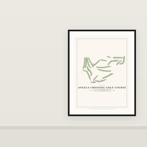 May include: A framed print featuring a minimalist map of the Angels Crossing Golf Course in Vicksburg, Michigan. The design displays green fairways on a cream background with black text detailing the location, architect, year, and length.