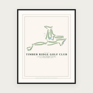May include: A framed print featuring a map of the Timber Ridge Golf Club in East Lansing, Michigan. The design displays the course layout in green with blue water hazards on a cream background, including text details on architect and length.
