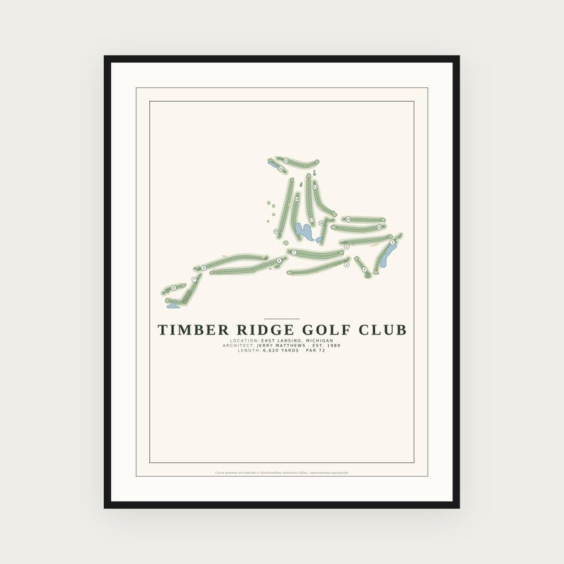 May include: A framed print featuring a map of the Timber Ridge Golf Club in East Lansing, Michigan. The design displays the course layout in green with blue water hazards on a cream background, including text details on architect and length.