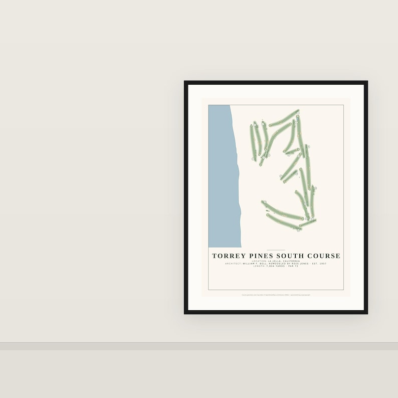 May include: A framed print featuring a map of the Torrey Pines South Course. The design includes a light blue vertical strip representing the coast, green golf course fairways, and text reading TORREY PINES SOUTH COURSE, LOCATION: LA JOLLA, CALIFORNIA, ARCHITECT: WILLIAM F. BELL; REMODELED BY REES JONES | EST. 1957 | LENGTH: 7,802 YARDS | PAR 72.
