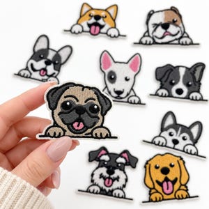 May include: A collection of embroidered iron-on patches featuring various dog breeds, including a pug, corgi, bulldog, and husky. Each patch depicts a dog peeking over a horizontal line with paws visible, showcasing detailed stitching and vibrant colors.