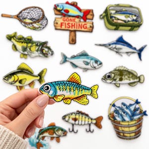 May include: A collection of embroidered iron-on patches featuring various fishing-themed designs, including multiple species of fish, a net, a tackle box, a wooden sign with the text GONE FISHING, and a bucket filled with blue fish.