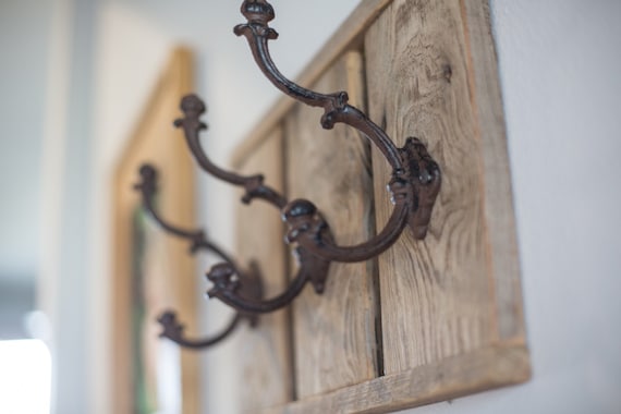cast iron and wood coat rack