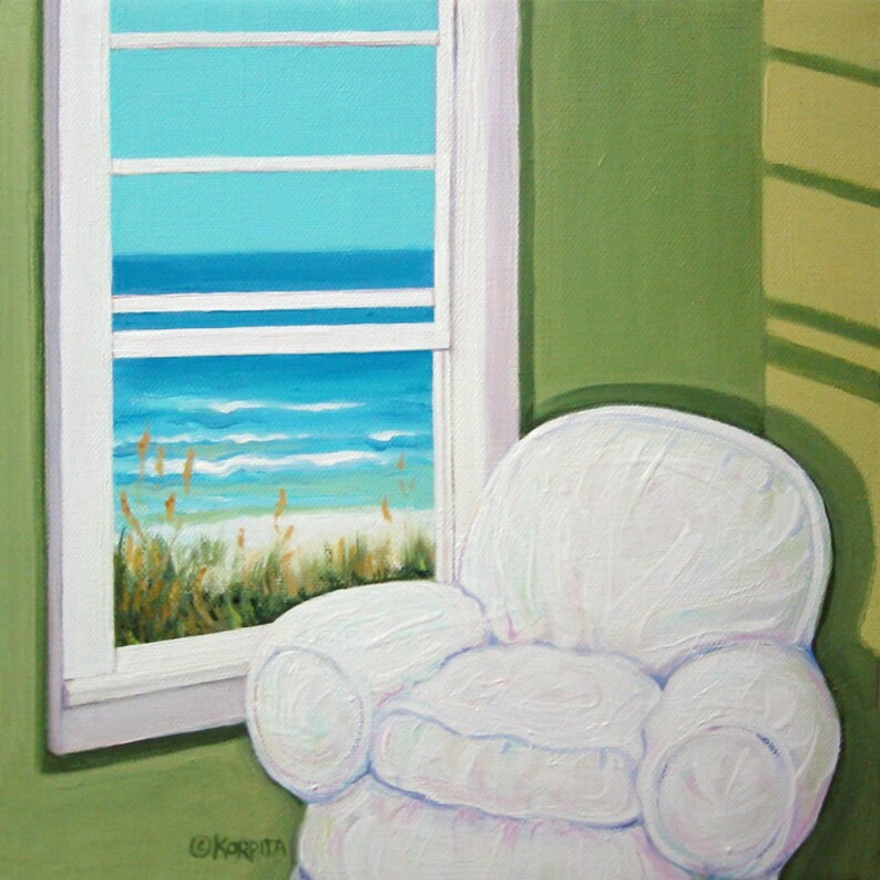 May include: A white armchair sits in a room with a window overlooking a beach scene. The window has white trim and the wall is painted a light green color.