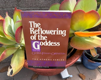 Goddess book and double ax labris button