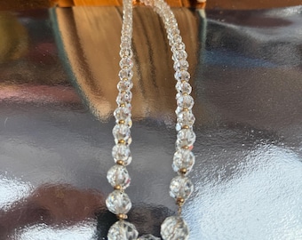Crystal beaded necklace with small gold beads in between.
