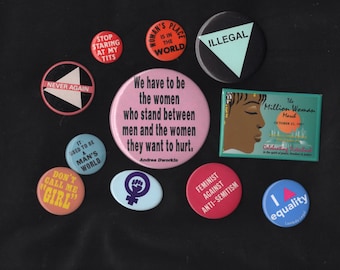 Feminist protest buttons from 80s and 90s