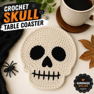 May include: A cream-colored crochet skull table coaster featuring black yarn details for the eye sockets, nose, and stitched mouth. The text CROCHET SKULL TABLE COASTER is visible at the top, and a small badge reads HANDMADE WITH LOVE.