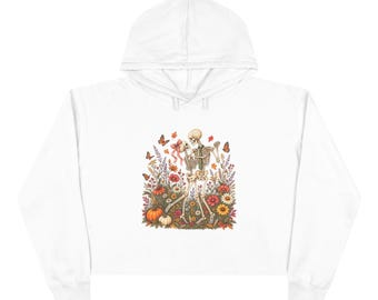Hoodie met skelet in wilde bloemen | Illustratie van een schedel met bloemen en vlinder