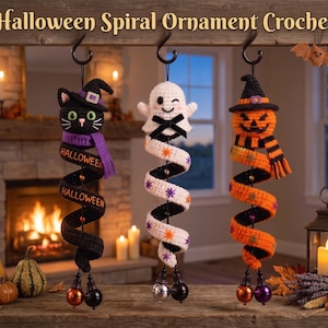 May include: Three hanging spiral crochet ornaments featuring a black cat in a witch hat, a white ghost with a black bow, and an orange jack-o'-lantern in a witch hat. Each ornament has a long, coiled body with festive details and small bells.