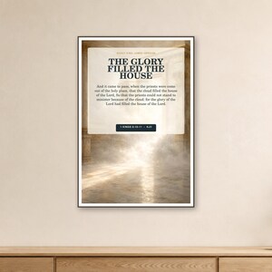 May include: A rectangular wall art print featuring the text THE GLORY FILLED THE HOUSE and a passage from 1 Kings 8:10-11 KJV. The background shows a bright, ethereal light emanating from a stone archway, creating a hazy, glowing atmosphere.