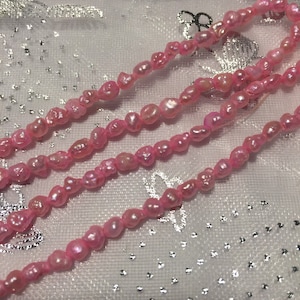 Seed Pearls. Pink Dyed Small Rice/Seed Pearl. 21&quot; total in lot. 5 x 3 mm Pearls.