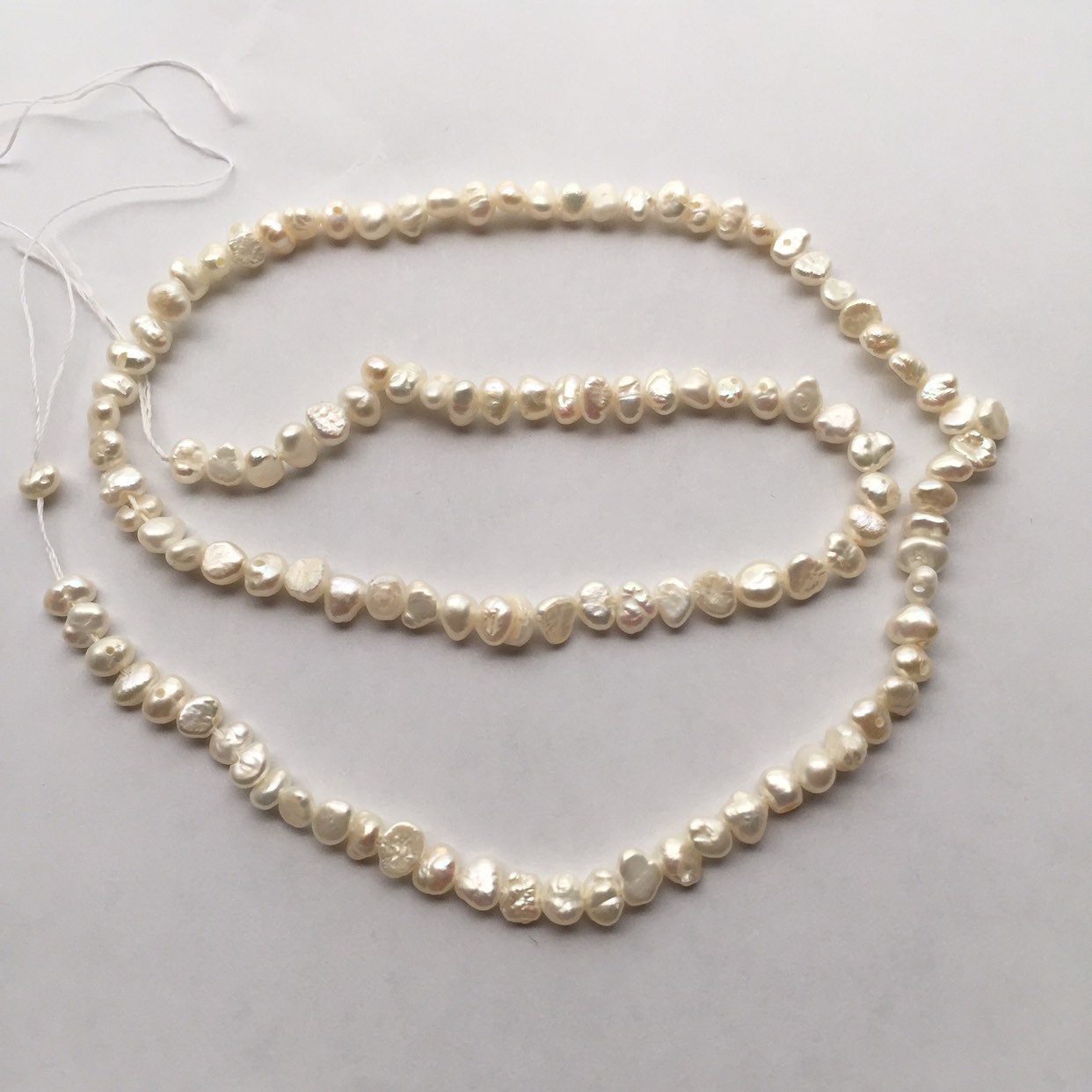 Rare Japanese Biwa Lentil Pearls, 15.5" strand. 4 to 5mm 3 to 3.5mm thick 115 Pearls