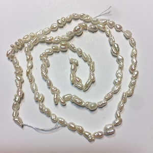 Rice Pearls. 16” strand. 3 x 5.5mm