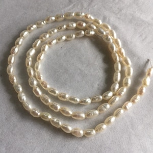Rice Pearls from Japan. 3 x 5mm. 15.5&quot; Strand.