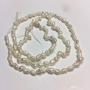 Rice Pearls. 16” strand. 3 x 5.5mm. High Luster.