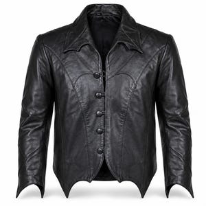 May include: A black leather jacket featuring a pointed collar, long sleeves, and a front closure with five round black buttons. The hemline is cut into a series of sharp, angular points, and the garment includes decorative seam detailing across the chest.