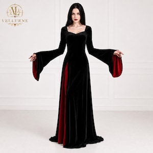 May include: A floor-length black velvet dress featuring long flared sleeves with deep red lining, a sweetheart neckline, and a high side slit revealing a red fabric panel. The Vellurne logo is visible in the upper left corner of the image.