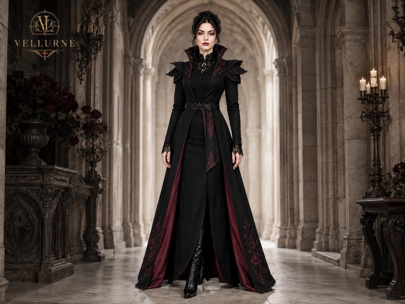 Women’s gothic vampire costume featuring a black Victorian long coat, burgundy embroidered panels, high collar and dramatic shoulders.